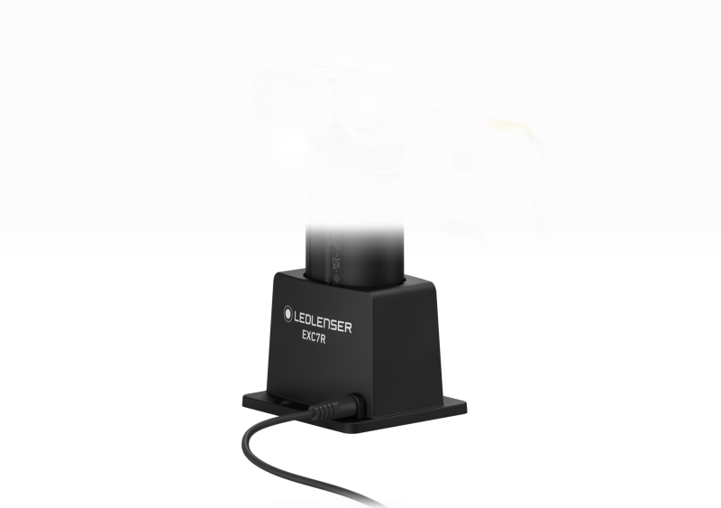 Three quarter front view of charging station for ultra-compact, yellow and black Ledlenser EXC7R rechargeable torch
