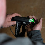Worker removing the batteries from a Ledlenser headlamp