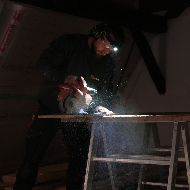 Worker wearing a Ledlenser headlamp to light his work area