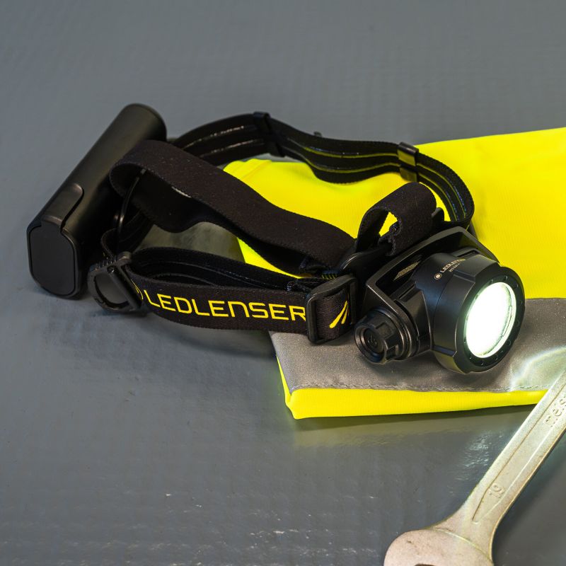 Front view of Ledlenser H15R Pro Headlamp sitting on hi-vis vest