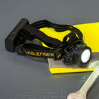 Front view of Ledlenser H15R Pro Headlamp sitting on hi-vis vest