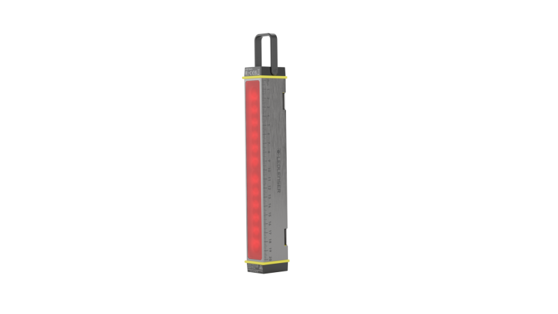 Front three-quarter vertical view of Ledlenser AF2R compact multi-purpose light tool with rubber hook for hanging. Shown in red light mode.