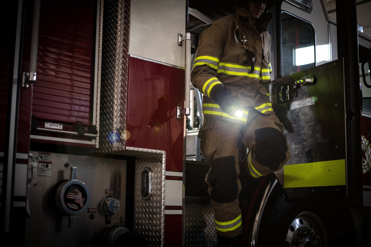 Firefighter using Ledlenser EX7 torch to light their way