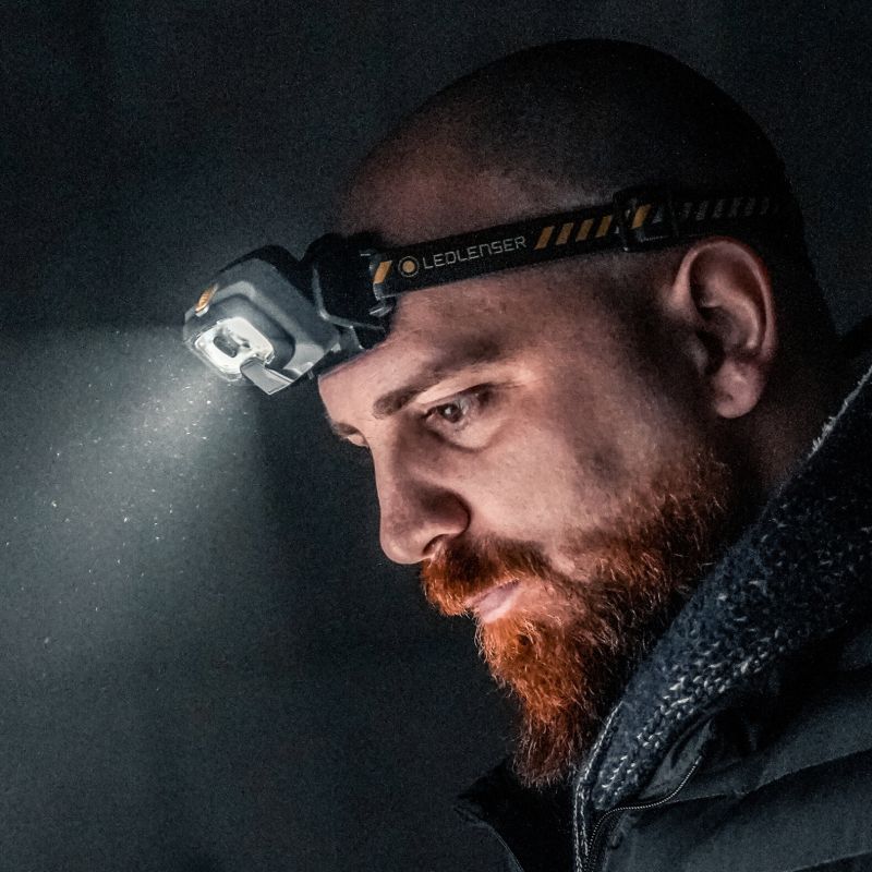 Bearded man wearing the HF8R Work Headlamp