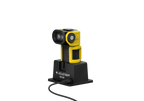 Three quarter front view of the ultra-compact, yellow and black Ledlenser EXC6R rechargeable torch shown sitting on charging station. 