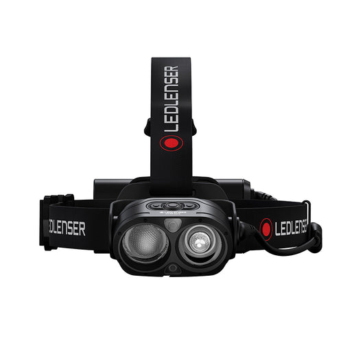Front view of Ledlenser H19R Core rechargeable headlamp with dual light sources, red/black branded overhead strap and battery pack - Black | Ships Within New Zealand