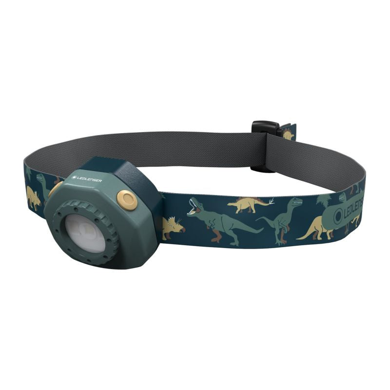 Front three-quarter view the Ledlenser KIDLED4R battery-operated headlamp with headlamp and headband in fun styles - Lamp Dark Green, Head Band Dinosaur Pattern
