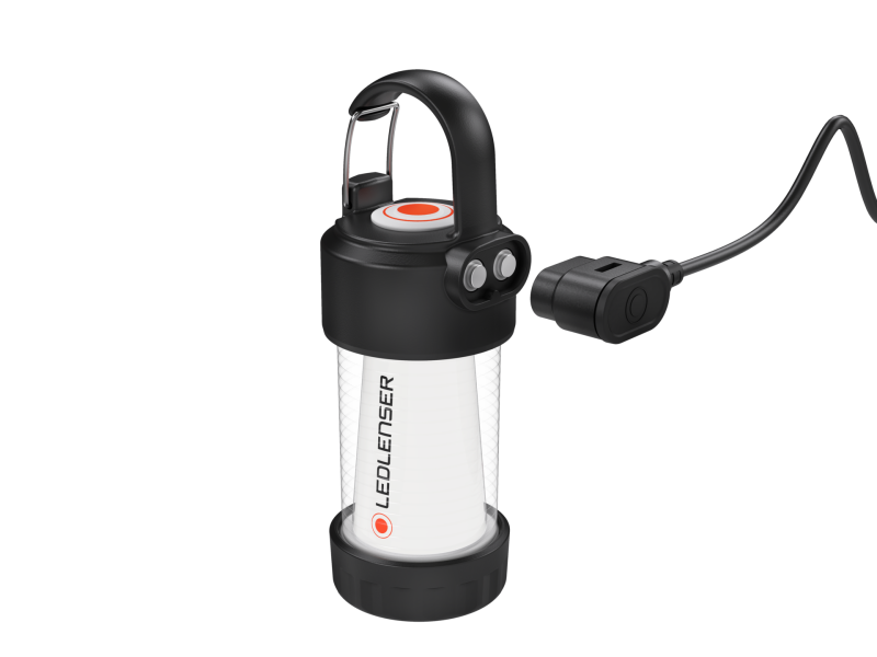 Side three quarter view the Ledlenser ML4 warm light rechargeable lantern with carabiner snap hook on top and showing magnetic charging port with charger cable positioned next to it - Black