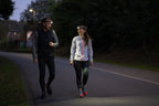 Image of couple lighting their way on a walk at dusk using the Ledlenser NEO3 headlamp with reflective headband – Blue 
