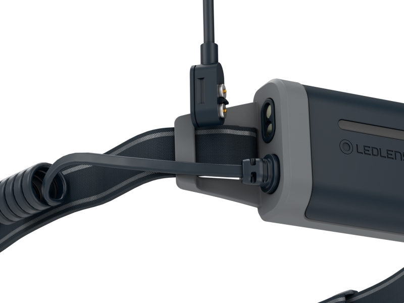 Close up of magnetic charging point on Ledlenser NEO5R rechargeable headlamp with headband – Black/Grey