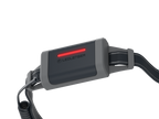 Close up of battery on Ledlenser NEO5R rechargeable headlamp with headband showing red flashing rear light. – Black/Grey