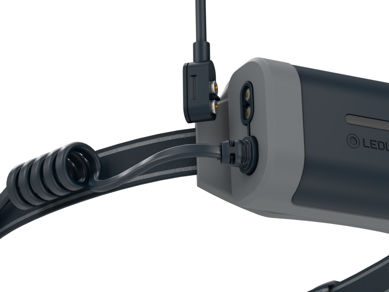 Close up of magnetic charging point on Ledlenser NEO9R headlamp - Black/Grey