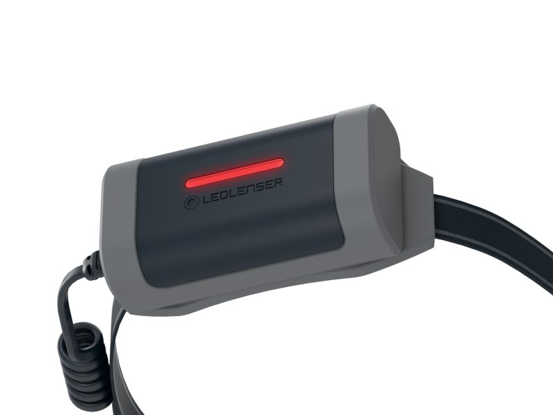 Close up of battery with flashing red safety light on Ledlenser NEO9R headlamp - Black/Grey