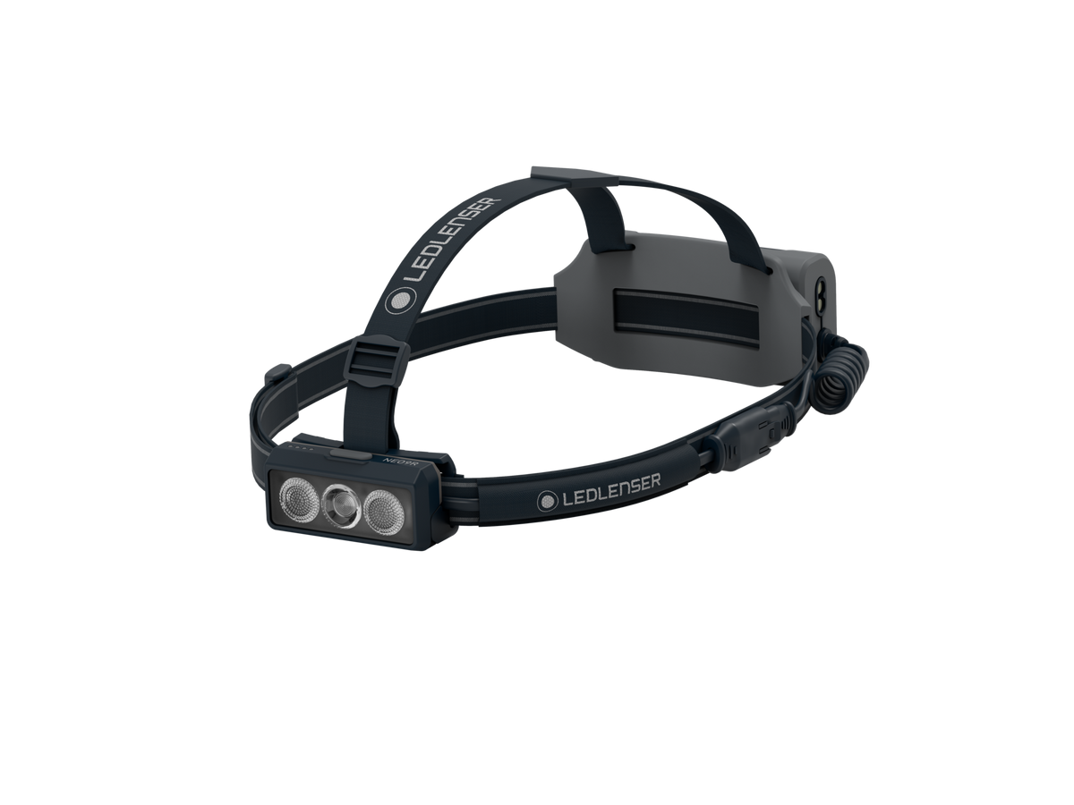 Front three-quarter view the Ledlenser NEO9R rechargeable headlamp with branded headband including overhead band – Black/Grey