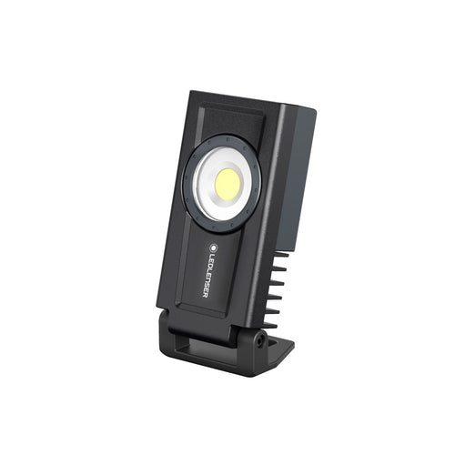 Three quarter front right view of rectangular Ledlenser If3R rechargeable work light  with stand engaged – Black  | Ships Within New Zealand