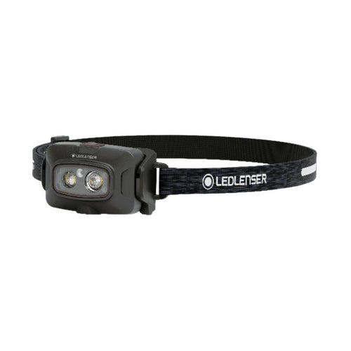Three quarter front view of Ledlenser HF4R Signature rechargeable headlamp with black/white branded head strap - Black