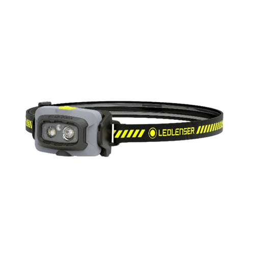 Three quarter front view of Ledlenser HF4R Work rechargeable headlamp with yellow/black branded head strap - Black