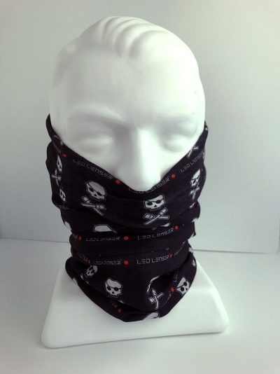 A black head wrap with a white skull and crossbones pattern and Ledlenser logo displayed on a mannequin head | Wrap Ships Within New Zealand
